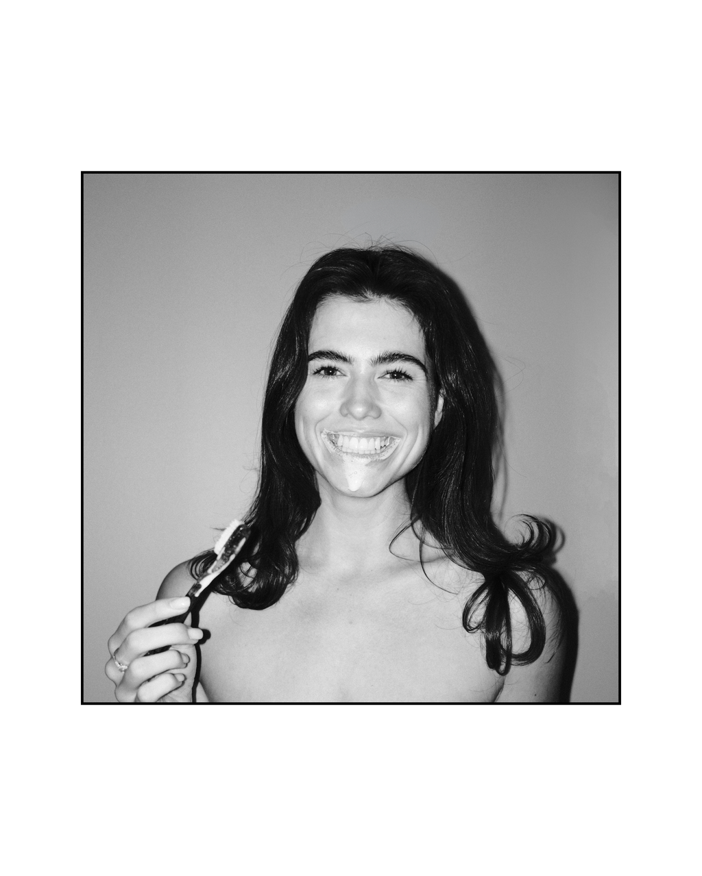 Woman smiling with Natuoral fluoride-free hydroxyapatite toothpaste — natural whitening oral care